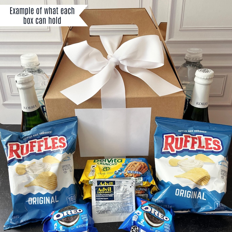 a box of chips, chips, and a bottle of wine
