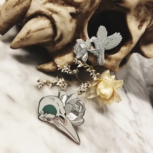 Death and Rebirth Metal Pin . Glow in the Dark . Crow Skull & Deathly Olive Branch