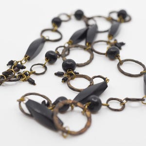 necklace Marc Labat vintage designer costume jewellery long single strand French sautoir black brass modernist revival made in France c1980s