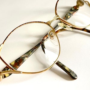 eyewear French vintage designer NINA RICCI glasses frame model 54016 gold tone metal acrylic pattern arms stamped made in France 1980s rare
