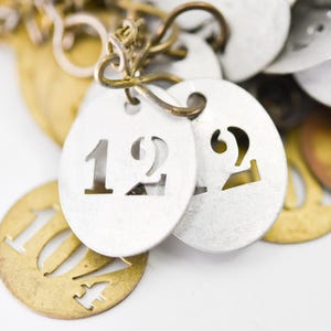 large lot of 75 metal number tags French vintage brass silver tone stencil token plates door cutout locker round oval some with chains rare