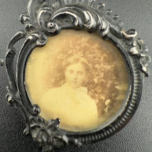 antique miniature portrait brooch black silvered metal ornate frame picture of a woman in sepia tone French vintage jewellery pin 1900s rare