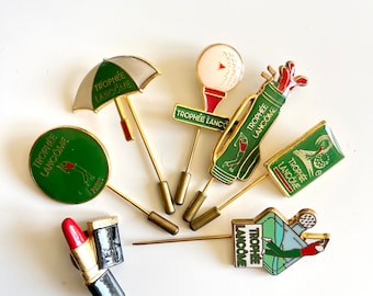 spille da golf LANCÔME Collezione Parigi lotto di 6 trofei verdi e un rossetto rosso nero Merchandising distintivo in metallo smaltato vintage francese