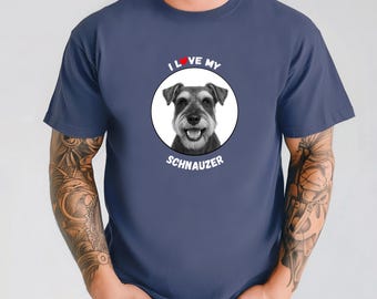 May include: Navy blue t-shirt featuring a Schnauzer dog portrait inside a white circle. The text "I LOVE MY SCHNAUZER" is arched above and below the dog image. The heart in "LOVE" is red.
