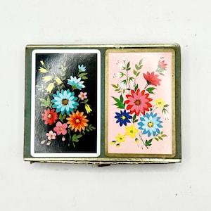 Juego de dos barajas vintage con diseño floral, cartas retro efímeras y naipes Congress.