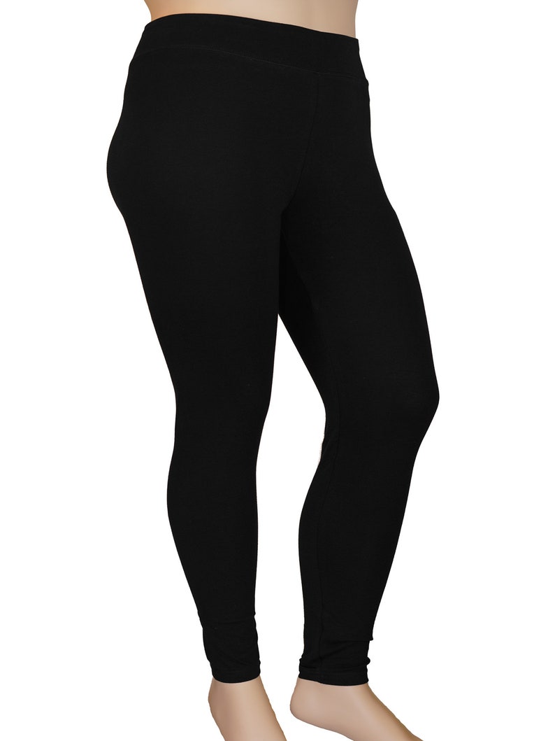 May include: Black leggings made from a soft, stretchy fabric. The leggings have a high waist and a slim fit.