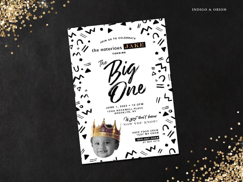 May include: Black and white birthday party invitation with a geometric pattern border. The invitation says "Join us to celebrate the notorious Jake turning The Big One". It includes the date, time, and location of the party. The invitation also includes a photo of a baby boy wearing a gold crown.