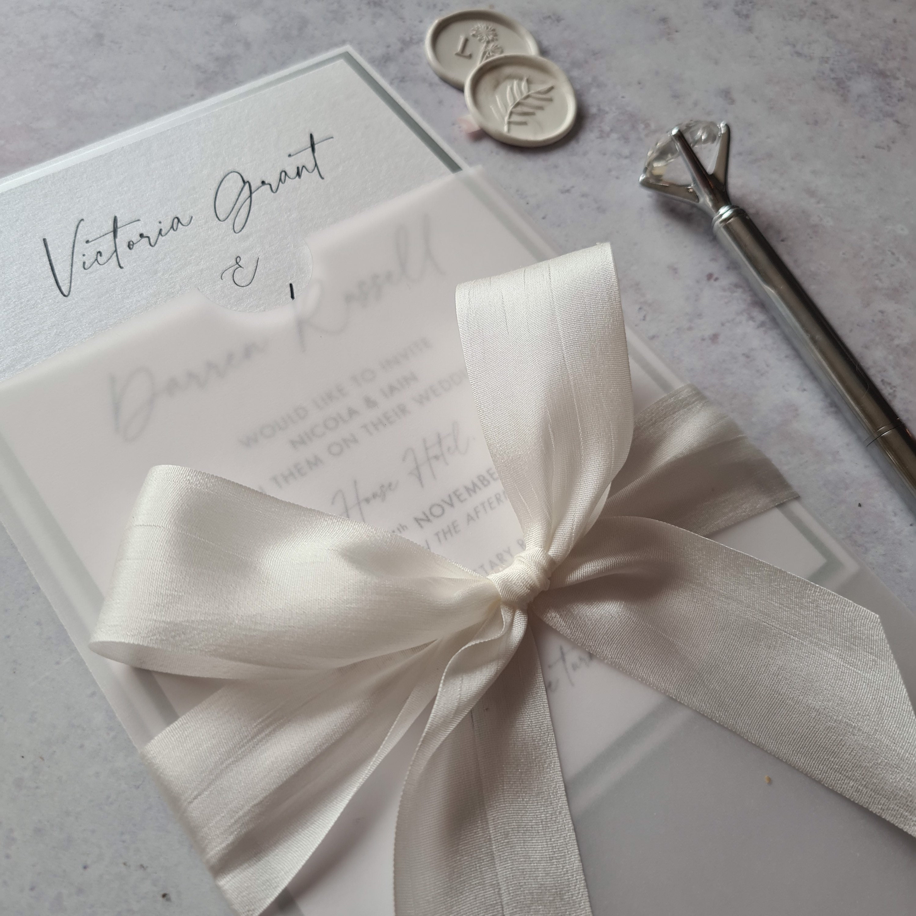 White Vellum Sleeve Wedding Invitation With Hand Dyed Silk Bow Silver