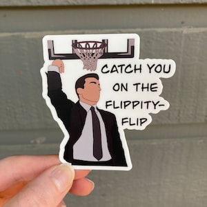May include: A white sticker with a cartoon illustration of a man in a suit dunking a basketball. The text on the sticker reads "Catch you on the flippity-flip."