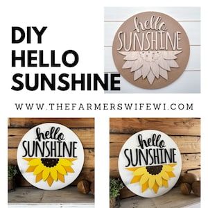 Pode incluir: Um letreiro de madeira DIY "Hello Sunshine" com um design de girassol. O letreiro &eacute; pintado de branco e tem letras pretas. O girassol &eacute; feito de madeira amarela e marrom.