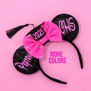 May include: Black glitter Minnie Mouse ears with a pink bow and a graduation cap with the year 2025 on it. The right ear has the text "CHS" on it and the left ear has the text "Pepron" on it.
