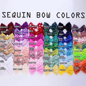 May include: A chart of sequin bow colours. The chart shows 36 different colours of sequin bows, arranged in rows and columns. Each bow is labelled with its colour name.