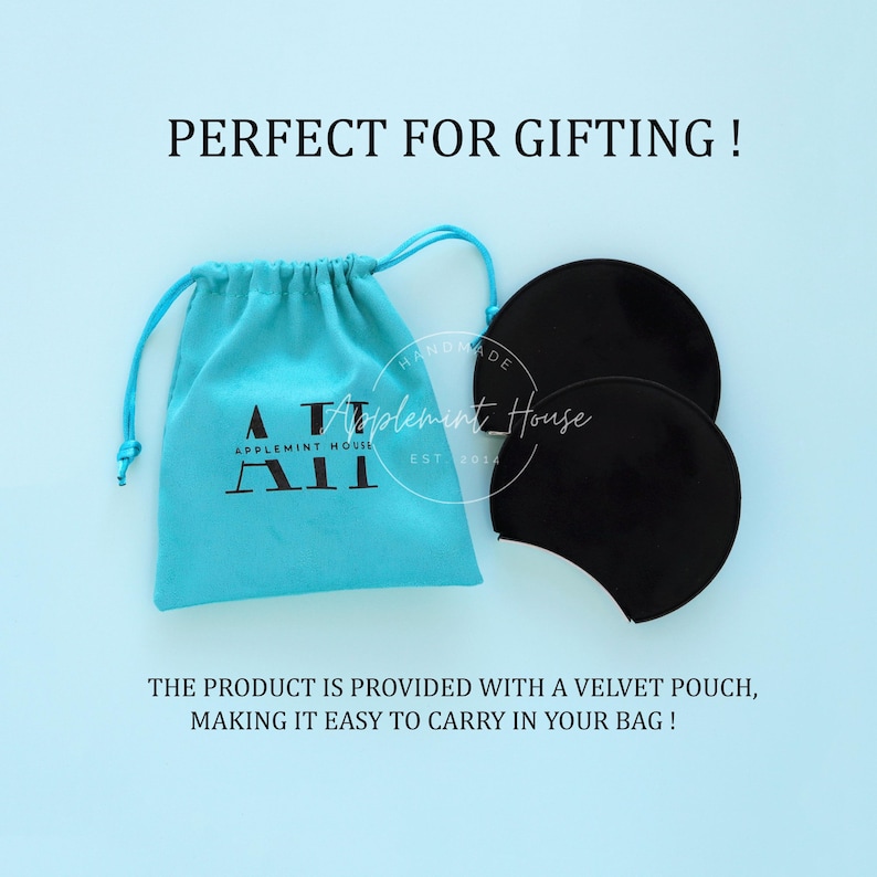 May include: A pair of black velvet ear warmers with a turquoise blue velvet pouch. The pouch has the text "HANDMADE Applement House APPLEMINT HOUSE A&Pi; EST 2014" printed on it.