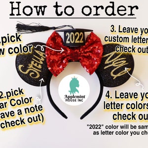 May include: A pair of black mouse ears with gold glitter and the names "Stella" and "2022" on them. A red sequined bow is attached to the top of the ears. The ears are on a black headband. The image includes instructions on how to order custom mouse ears.