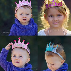 May include: Four pink, gold, and blue glitter princess crowns with names Anna, Rachel, Clair, and Abby. The crowns are on headbands and are worn by four children.
