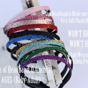 May include: A stack of 10 colorful glitter headbands in various colors, including pink, red, black, blue, gold, silver, green, and purple. The headbands are 0.4 inches thick and fit all ages. The text on the image reads: "Our Headband is Made out of flexible & Very Soft PlasticMaterials. WON'T BREAK WON'T HURT While Wearing the band For a long Period of Time."
