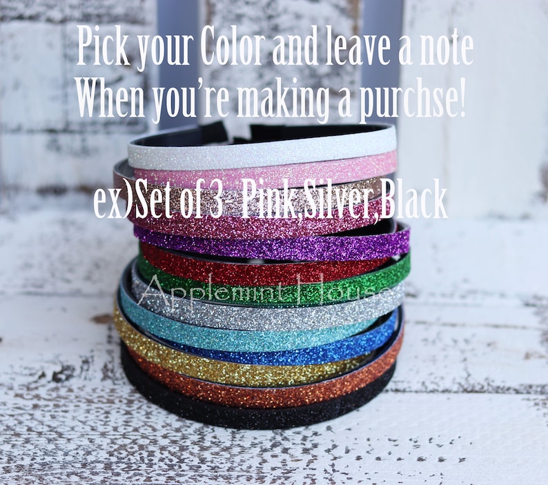 May include: A stack of 10 glitter headbands in various colors, including pink, silver, black, red, green, blue, and gold. The text "ex) Set of 3 Pink, Silver, Black" is visible on the image.