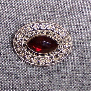 Antique art deco red glass filigree oval brooch