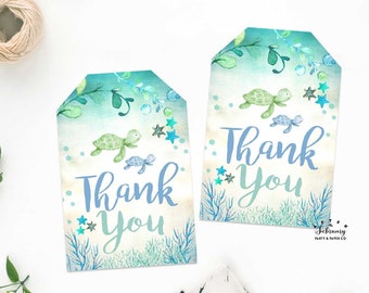 May include: Two blue and green watercolor thank you tags with a sea turtle design. The tags have a white background with blue and green watercolor accents. The text "Thank You" is written in blue letters on each tag.