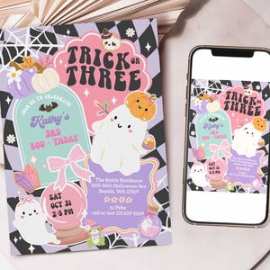 May include: A Halloween-themed invitation and a smartphone display. The invitation features a ghost, pumpkin, and the text "Trick or Three". The invitation is decorated with pastel colors and the text "Kathy's 3rd Boo-thday". The smartphone displays the same design.