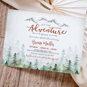 May include: A watercolor-style invitation for a bridal shower with a mountain and forest theme. The invitation reads "Let the Adventure Begin" and includes the bride's name, date, time, and location. The invitation is decorated with a watercolor illustration of mountains and trees.
