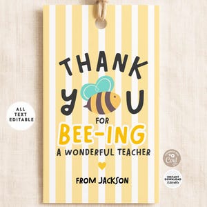 May include: A yellow and white striped gift tag with the text "THANK YOU" and "BEE-ING A WONDERFUL TEACHER". A cartoon bee graphic is in the center. The tag is personalized with the name "Jackson".