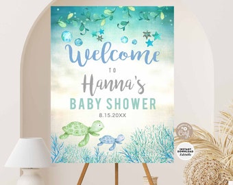 May include: A welcome sign for a baby shower with a blue and green watercolor background. The sign features two sea turtles, seaweed, and stars. The text on the sign reads "Welcome to Hanna's Baby Shower 8.15.20XX".