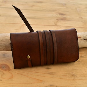 Brown leather tobacco pouch with strap