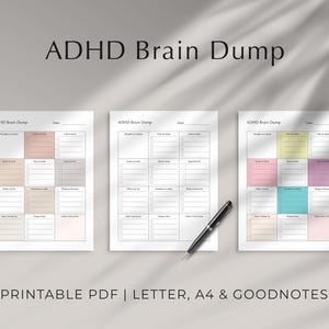 Pode incluir: Três folhas imprimíveis de "ADHD Brain Dump" com caixas coloridas e caixas de seleção. As folhas são rotuladas com categorias como "Pensamentos a incluir" e "Coisas para comprar". Uma caneta preta repousa sobre a superfície. O texto na parte inferior diz "PRINTABLE PDF | LETTER, A4 & GOODNOTES."
