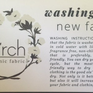 May include: A white card with black text and illustrations. The text reads "birch organic fabric" and "washing your new fabrics". The card provides instructions for washing new fabrics, suggesting a gentle cycle in cold water with a fragrance-free detergent and air drying.