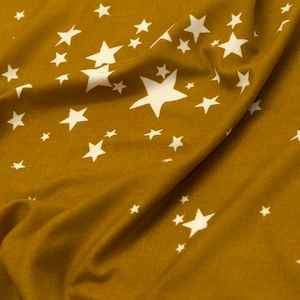 Double brushed poly stars on mustard knit fabric REMNANT, knit fabric remnant, star fabric, yellow with white stars double brushed polyester