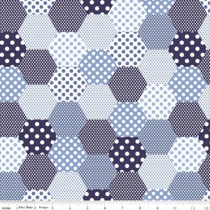 May include: A blue and white fabric with a repeating pattern of hexagons. Each hexagon has a different polka dot pattern. The fabric is 12 inches wide.