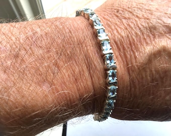 Sterling Silver Blue Topaz Eternity Bracelet: Oval Cut Gemstone