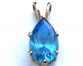 14k Swiss blue Topaz pendant 1/2 Ct. pear cut