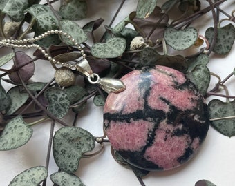 rhodonite pendant in stainless steel bail, "Tender portrait"