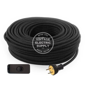 May include: A spool of black cloth-covered electrical cord with a black inline switch and a black and gold two-prong plug. The spool is labeled "Antique Style Vintage Electric Supply Modern Function".