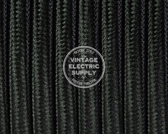 May include: Close-up of black and green braided electrical cord. The cord has a textured surface and is made of multiple strands of wire. The cord is labeled "Antique Style Vintage Electric Supply Modern Function".