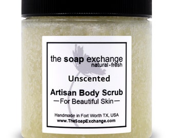 May include: A clear jar of unscented artisan body scrub with a white label that reads "the soap exchange natural-fresh Unscented Artisan Body Scrub -For Beautiful Skin- Handmade in Fort Worth TX, USA www.TheSoapExchange.com"