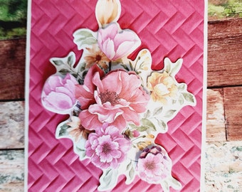 2 Happy Birthday floral bouquet of 3D Red, Pink and yellow flowers, on a red basket weave mat.