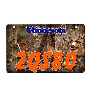 May include: A camouflage background with the text "Minnesota" in blue and the number "2QS80" in orange. A deer head is visible in the upper right corner of the image.