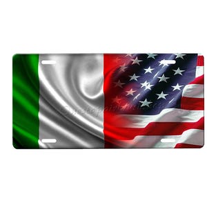 May include: A license plate featuring the Italian and American flags. The flags are waving in the wind and are both in focus. The Italian flag is on the left side of the plate and the American flag is on the right side.
