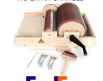 May include: A wooden drum carder machine with two cylindrical rollers covered in fine metal teeth, a black hand crank, two metal C-clamps, a wooden-handled cleaning brush, and a metal pick tool. The text FREE DELIVERY NO EXTRA CHARGES and FedEx appear.