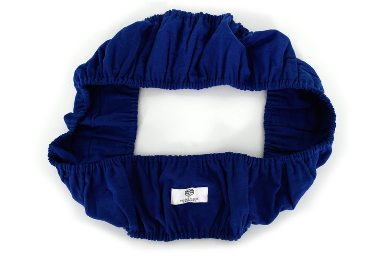 May include: A blue fitted chair cover with elastic edges. The cover has a white label with the text "Golden Fleece Furniture" on it.