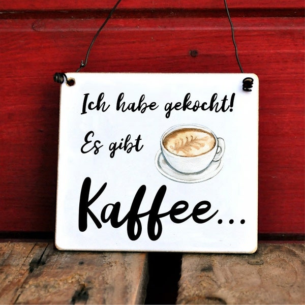 Schild mit Spruch Ich habe gekocht, es gibt Kaffee