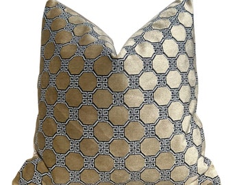 May include: A gold velvet pillow with a black and white geometric pattern. The pattern is a repeating design of octagons and squares.
