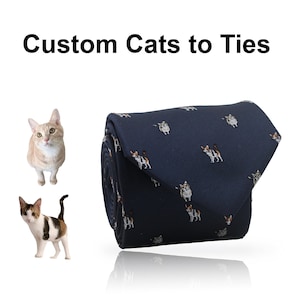 May include: A navy blue tie with a repeating pattern of various cat illustrations. The text "Custom Cats to Ties" is displayed above the tie. Two cat images are on the left side of the image.