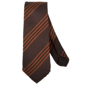 May include: A brown tie with a striped pattern. The tie features alternating stripes of brown, black, and orange. The tie is made of a textured fabric and is suitable for formal or business attire.