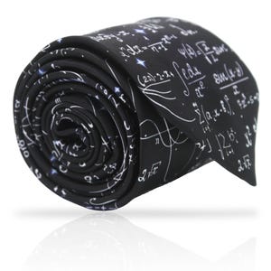 May include: Black necktie with white mathematical equations and symbols printed on it. The tie is rolled up and the tip is visible.