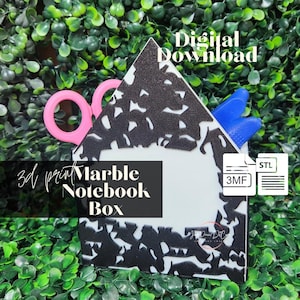 May include: A house-shaped 3D print marble notebook box with a black and white marbled pattern. The box contains pink scissors and blue tools. Text on the image reads Digital Download, 3d print Marble Notebook Box, 3MF, and STL.