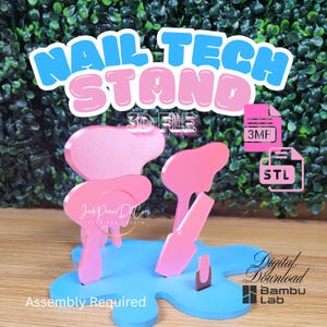May include: A light blue base shaped like a paint splatter with several pink upright stands for nail tips. The text reads NAIL TECH STAND, 3D FILE, 3MF, STL, Digital Download, Bambu Lab, and Assembly Required. The design is for 3D printing.